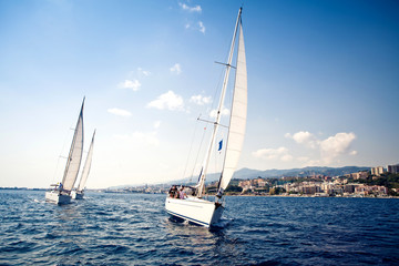 Sailing ship yachts with white sails