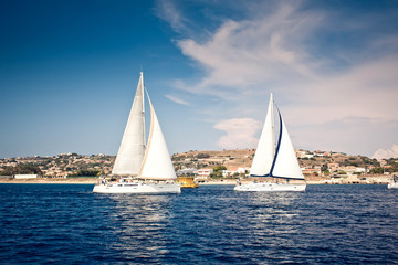 Fototapeta na wymiar Sailing ship yachts with white sails