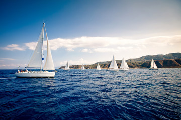 Sailing ship yachts with white sails