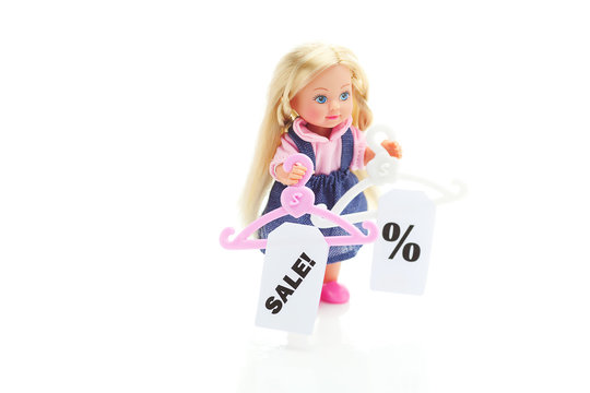 doll and hanger with a price tag sale isolated on white
