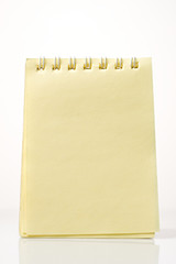 A yellow notepad on a white background