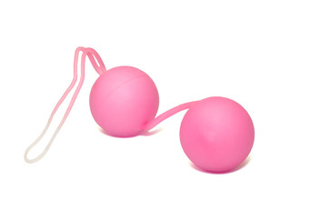 Pink vaginal balls isolated on a white background.