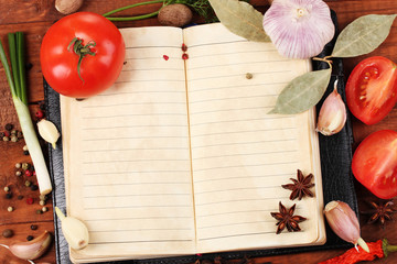 Naklejka na ściany i meble notebook for recipes and spices on wooden table