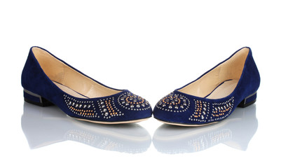 Elegant blue flat shoes for women in stones isolated on white