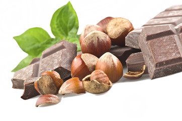 chocolate with nuts and leaves on the white
