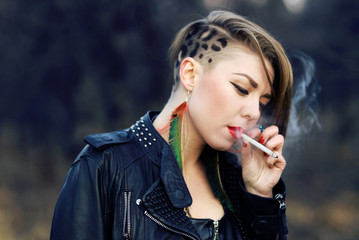 blond hipster girl with leopard haircut smoking cigarette alone