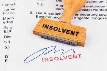 Holzstempel auf Dokument: Insolvent