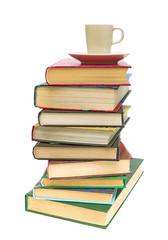 stack of books and coffee cup on white background