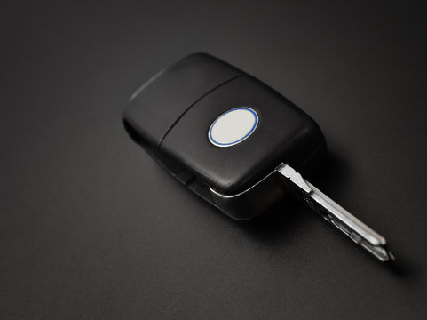 Car key on black background