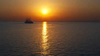 Naklejka na ściany i meble Sunset with ship