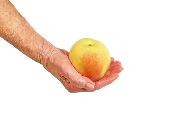 an elderly woman's hand with apple