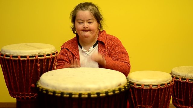 down syndrome woman with djembe