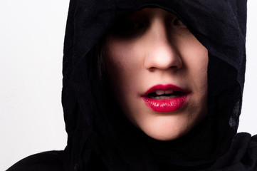 Woman with black hood against white isolated background