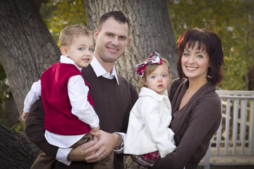 Young Attractive Parents and Children Portrait in Park