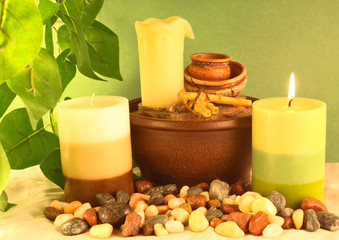 Candles and pebbles and leaves