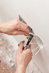 The hands of an electrician