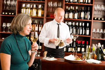 Wine bar senior woman enjoy wine glass