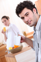 Couple in the kitchen at breakfast