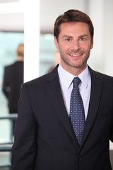Closeup of a smiling man in agency