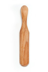 Kitchen wood Utensil for crepes on white background.