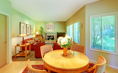 Large living room with breakfast table near kitchen.