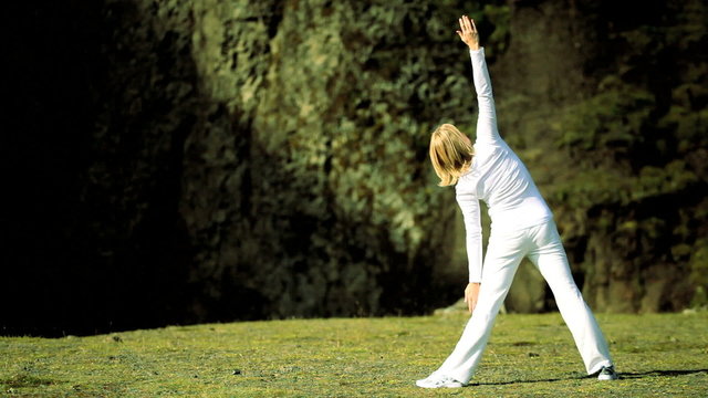 Female Yoga Exercises Outdoors