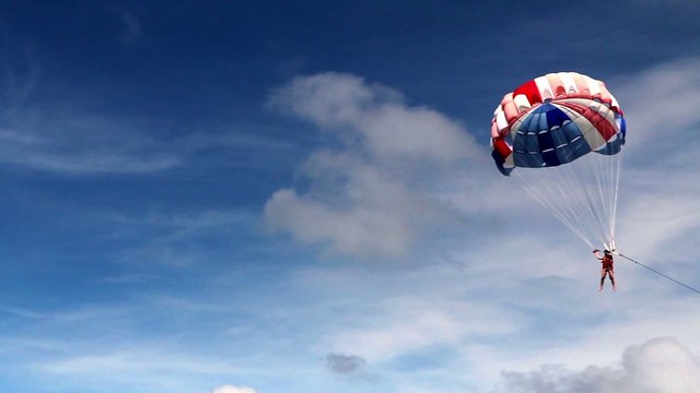 Parasailing, flying with parachute