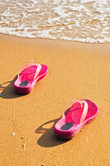 Fototapeta na wymiar Shoes onthe beach