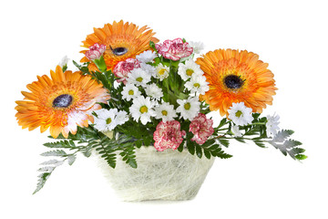 Bright flower bouquet in basket isolated over white background