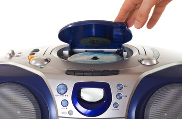 Obraz premium Inserting a disk into CD player