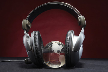 Fototapeta na wymiar glass globe and headphones