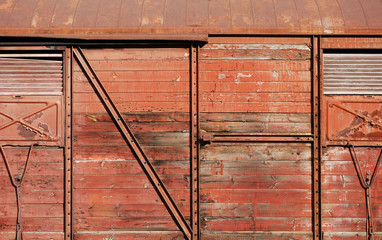 Wooden covered goods wagon as background