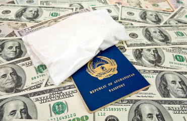 Package with a drug against the Afghan passports and U.S. dollar
