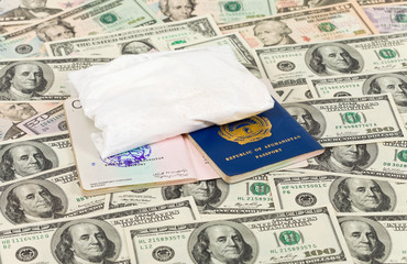 Package with a drug against the Afghan passports and U.S. dollar