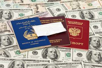Package with a drug against the passports and U.S. dollars