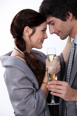 Elegant young couple drinking champagne