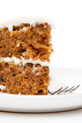 Slice of carrot cake isolated on white