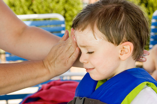 Little Boy Getting Sunscreen Application