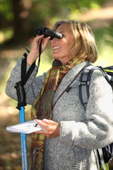 Woman in woods orienteering