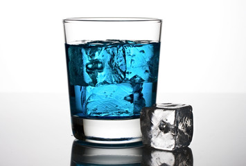 Blue cocktail with ice cubes