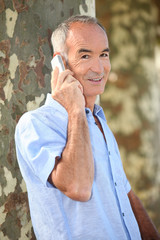 senior man at phone