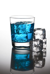 Blue cocktail with ice cubes