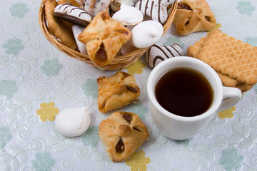 White cup of tea and biscuits