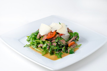 Beef steak with rucola and parmesan