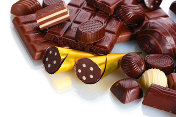 Many different chocolate candy isolated on white