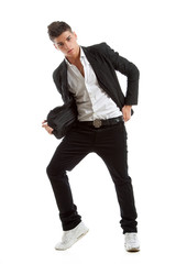 Young dancer posing in studio dressed in a suit
