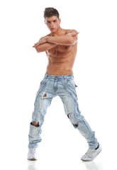 Sexy naked young dancer in jeans