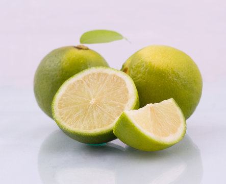 Fresh limes isolated on white