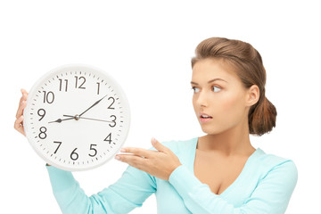 woman holding big clock