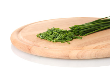 beautiful green onion chives on wooden board isolated on white